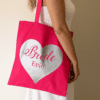Personalised heart canvas bag in pink with silver lettering for bride