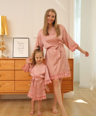 Mother and daughter wearing matching dusty rose pink satin lace robes – Children’s Personalised Satin Lace Robe from The Personalised Wedding Room