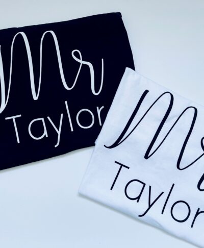 Bride wearing a white Personalised Mrs T-Shirt, customised with her name or date underneath—ideal for honeymoon or relaxed post-wedding moments.