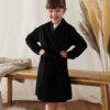 Smiling child wearing a black personalised cotton robe – perfect for flower girls, page boys, or junior bridesmaids on the wedding morning.