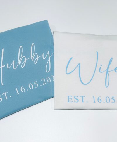 Two personalised t-shirts for a newly married couple, featuring the phrases 