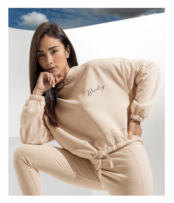 Bride wearing nude Personalised Bridal Loungewear Tracksuit with custom text, perfect for wedding mornings, hen parties and honeymoon comfort.